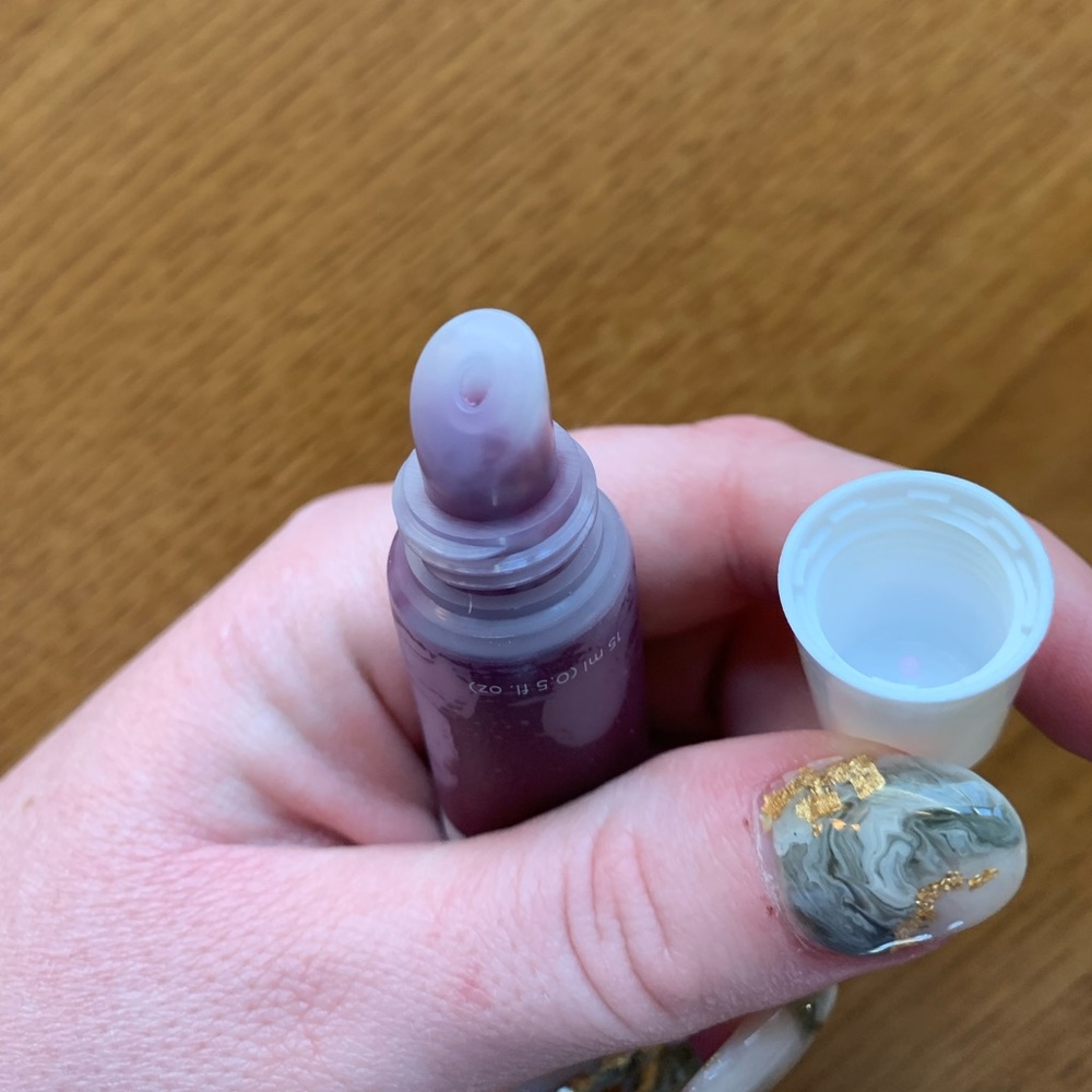 “Hey Honey” lip balm in berry/plum shade